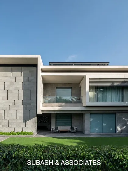The front facade of Residence 338 is dominated by a prominent rectangular block, creating depth and character. This element cohesively binds the entire design together for a powerful visual impact.
