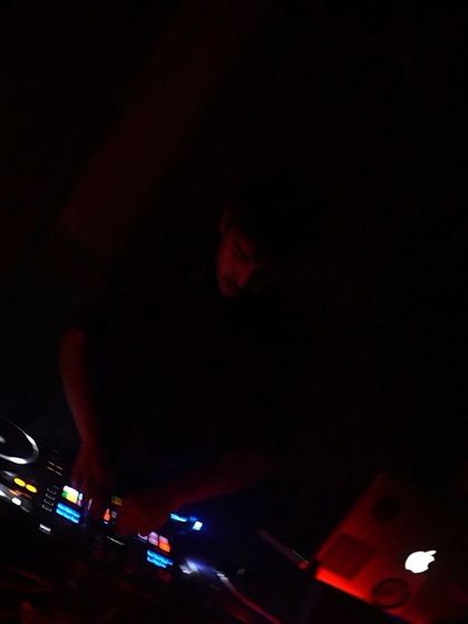 A dark, moody shot of me at the decks during Arcade 140.