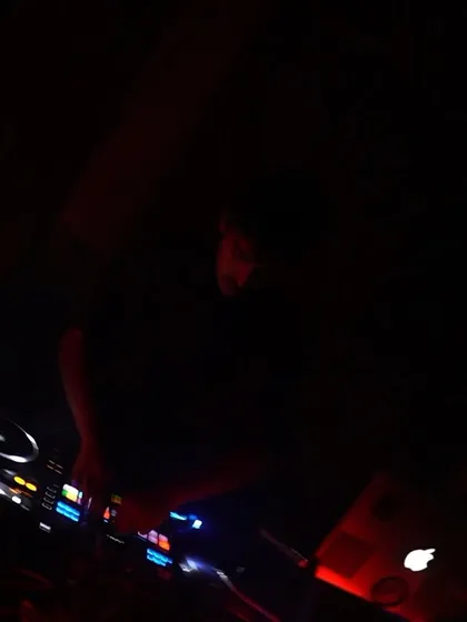 A dark, moody shot of me at the decks during Arcade 140.