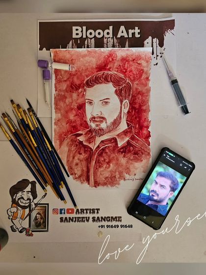 This flat-lay shows the final blood art portrait alongside the tools used to create it. From the blood vials to the brushes, each item is part of a careful and respectful process.