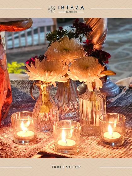A close-up of our table decor, where we use simple elements like fresh flowers and tea lights to create a beautiful and intimate atmosphere.