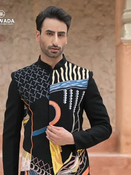 For the man who dares to be different. This bandhgala jacket features bold, abstract embroidery, turning a classic silhouette into a piece of wearable art.