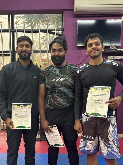 Posing with my coaches and fellow competitors after the Karnataka Open 2024. The support from your team is just as important as the work you do on the mats.