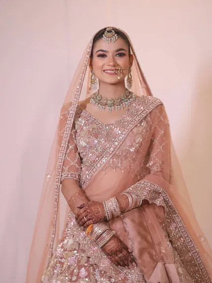 An effortlessly gorgeous portrait of my bride Shweta. The soft pink lehenga is complemented by a fresh, dewy makeup look perfect for a sundowner wedding.