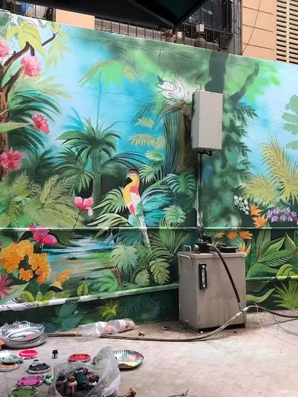 The full view of the tropical jungle wall, complete with parrots, butterflies, and lush greenery.