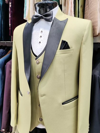 A collection of our designer suits, showcasing a variety of colors, fabrics, and custom details like embroidery, unique lapels, and accessories. Each piece is crafted to make a lasting impression.