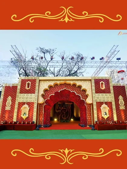 A majestic entrance for a royal-themed wedding. The grand archway, adorned with traditional carvings, sets a tone of opulence and heritage.