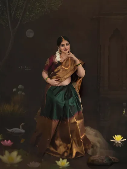 A graceful pose that showcases the elegance of the expecting mother and her traditional attire. My background as a classical dancer informs my guidance on posture, ensuring every frame is filled with poise.