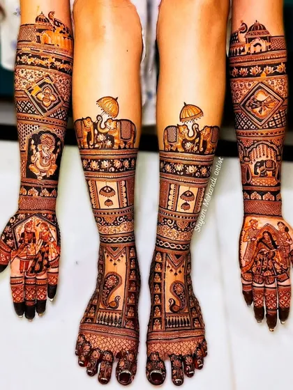 A complete bridal look, featuring exceptionally detailed mehandi on both hands and feet. This design includes traditional motifs like elephants and paisleys, demonstrating the full scope of my bridal packages.