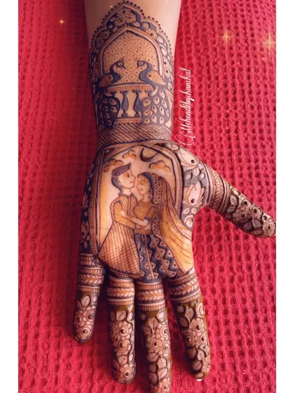 A close-up of the romantic Karwachauth couple portrait, framed by a peacock and jharokha design.