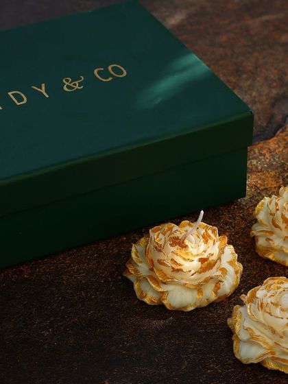 A set of three delicate peony candles, shown with my signature green gift box. These small, intricate floral candles are perfect for adding a touch of beauty to any gift.