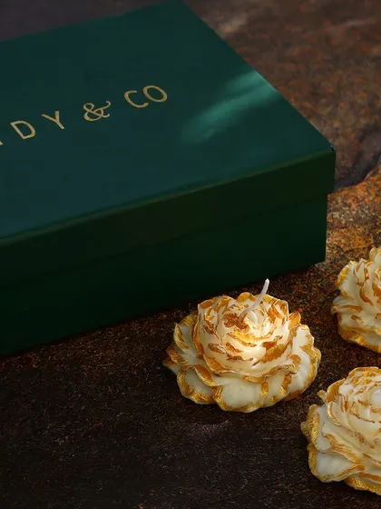 Three beautiful peony candles set against my signature green gift box.