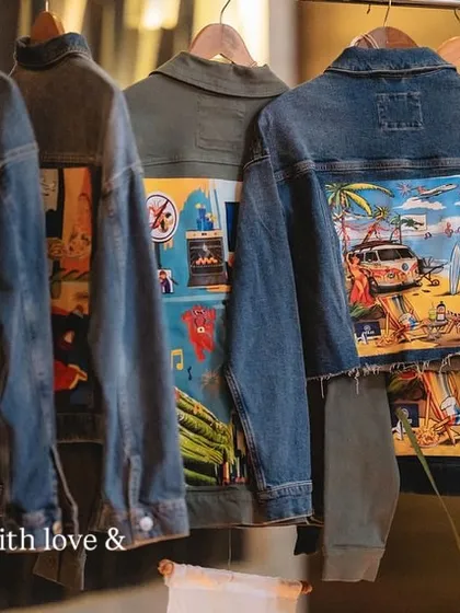 Another view of the custom wedding jackets hanging on the rack.