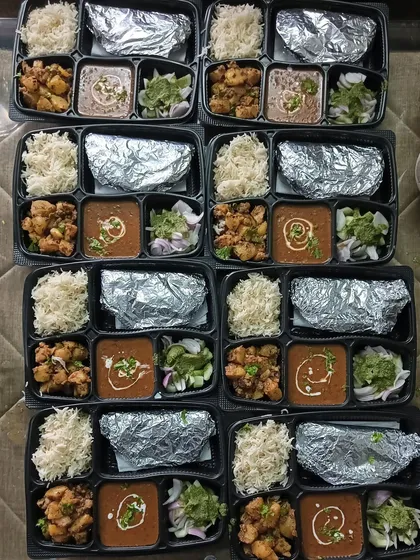 A large order of Dal Makhni thalis ready to be dispatched. Each thali is carefully packed to ensure it reaches the customer fresh and hot.
