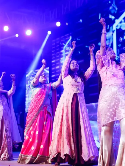 The ladies of the family celebrating together on stage. Group performances are a beautiful way to show love and support for the happy couple.