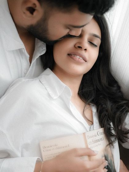 An intimate pre-wedding photo capturing a gentle kiss on the forehead. These sessions are about creating a space where you can be yourselves and let your love shine.