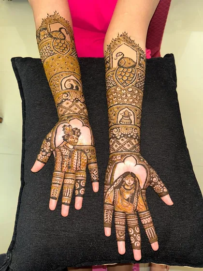 I can weave your story into your mehendi with custom portrait work. This design features beautifully detailed figures of the bride and groom, along with traditional motifs like peacocks, making it truly personal.