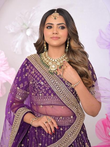 A closer look at the soft curls, showing how they frame the face and complement the bride's features.