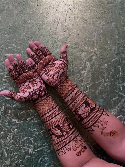 The reverse side of the baby naming ceremony design, showing how the patterns and names flow along the arms.