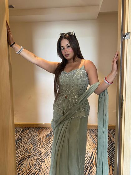 Posing in a beautiful sage green outfit. I believe an anchor's attire should complement the event's decor and mood, and this elegant piece was perfect for a sophisticated daytime function.
