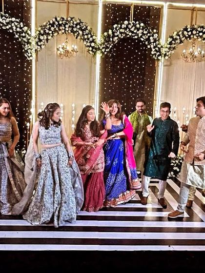 A fun dance-off between the girls and boys. These group performances are a great way to get everyone involved and add some friendly competition to the sangeet.