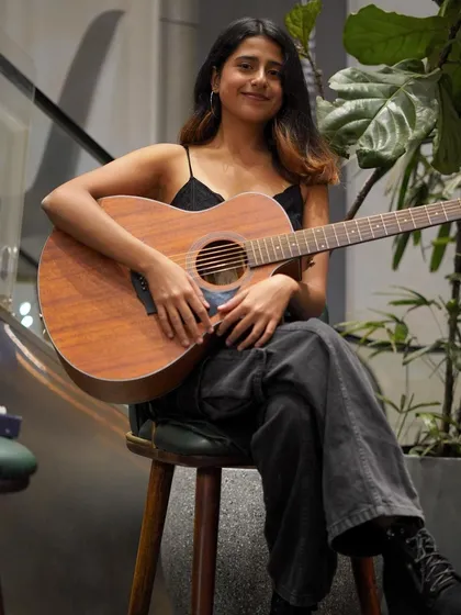 Taking a moment between songs. These solo acoustic gigs in cafes are perfect for a chilled-out, personal musical experience.