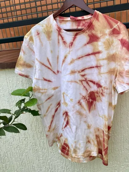 A made-to-order tie-dye t-shirt, featuring a spiral pattern in two beautiful, earthy tones. I love creating custom pieces that reflect the wearer's personal style.