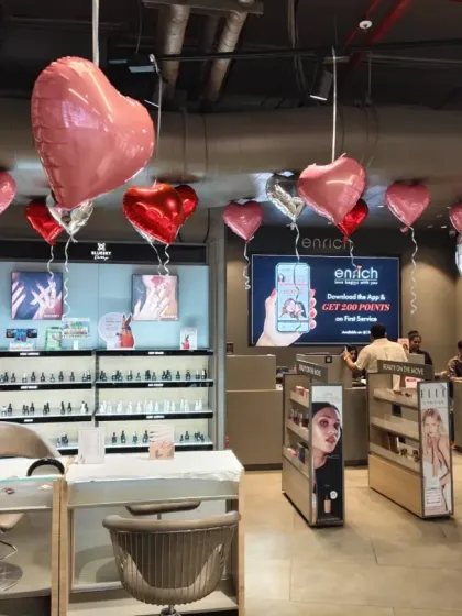 I can transform any retail or corporate space for seasonal events. Here, I added a simple yet festive touch to a salon for Valentine's Day using red, pink, and silver heart-shaped foil balloons to create a welcoming atmosphere for customers.