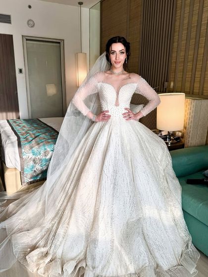 The full view of her magnificent bridal gown. The makeup was designed to complement the grandeur of her dress.