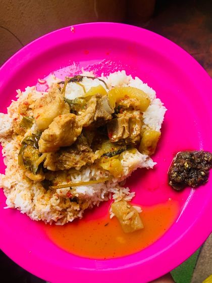 A comforting meal of fresh pork cooked with bottle gourd, bamboo shoot, and fresh Sichuan and balm leaves. A dollop of dark, spicy chutney completes the plate.