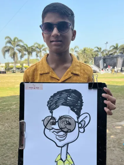 A young guest looking cool in his sunglasses, and his caricature reflects that same attitude.