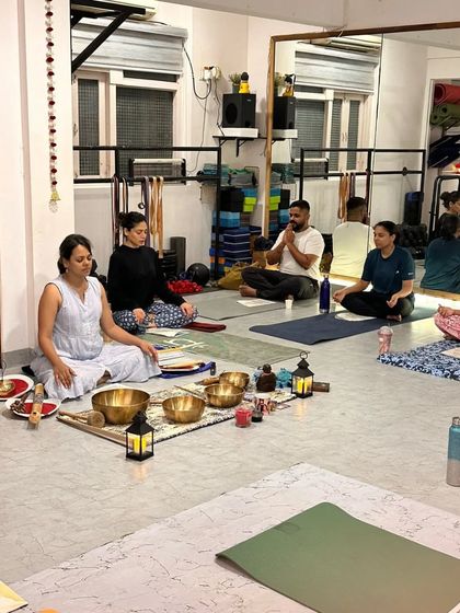 A wider view of our sound bath session, with participants settled in for an evening of chanting and healing vibrations.