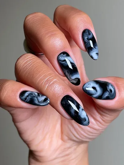A stunning black and white marble smoke effect created with blossom gel, another technique taught in our popular nail art masterclass.