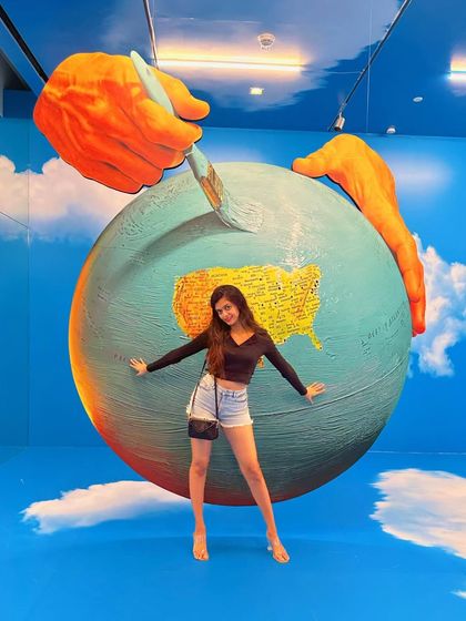 A dancer's pose at the NMACC art gallery. I love how this installation makes you feel like you are painting the world.