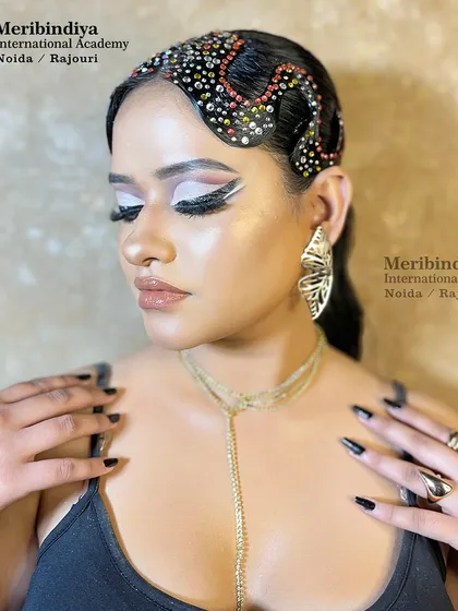 This image shows the full effect of the high-fashion look, demonstrating how to balance dramatic eyes with a glossy, neutral lip.