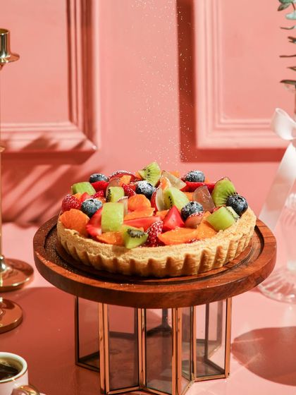 A close-up of our fruitful dessert, showing the glistening fresh fruit and crisp tart shell.