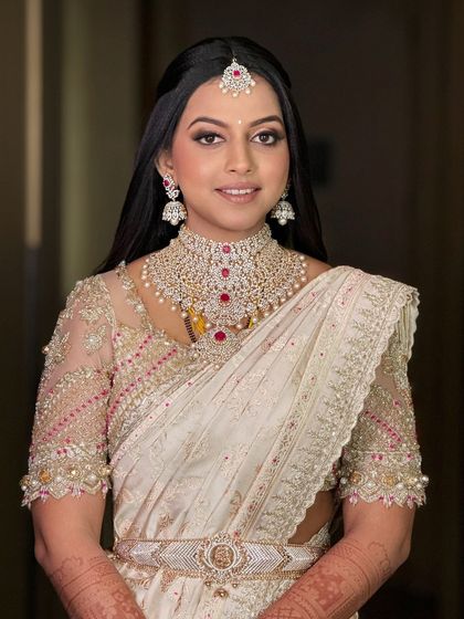 A classic portrait of the bride, her makeup looking elegant and timeless, perfect for her reception.