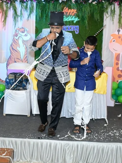 The paper-from-mouth trick is double the fun with two volunteers. This is a classic piece of comedy magic that guarantees a hilarious photo opportunity and a lasting memory.