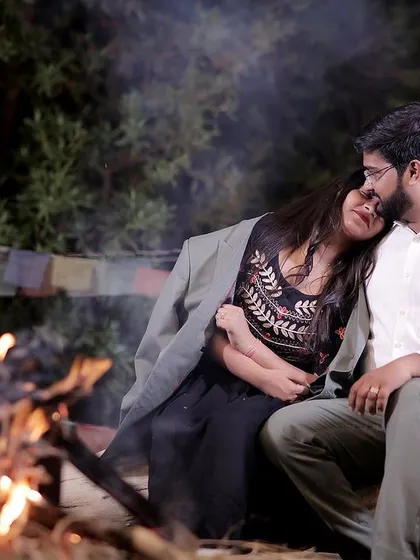Our outdoor campfire setup is perfect for capturing cozy, romantic moments at night. The warm glow of the fire and the rustic seating create an intimate atmosphere for your couple's photoshoot.