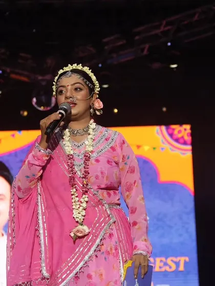 A close-up of me hosting as Radha, showing the intricate details of the makeup and jewelry.