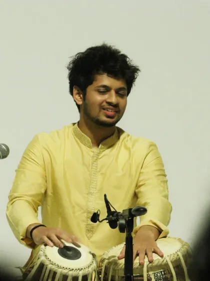 Deep in concentration during a complex rhythmic cycle. A solo performance is a test of focus, stamina, and creativity, all learned through years of dedicated riyaz.
