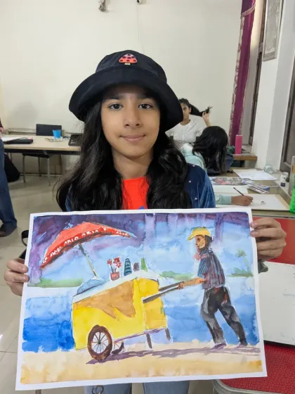 This watercolor painting tells a story. A student from our teen batch has beautifully painted a street vendor with his cart, capturing a slice of daily life.