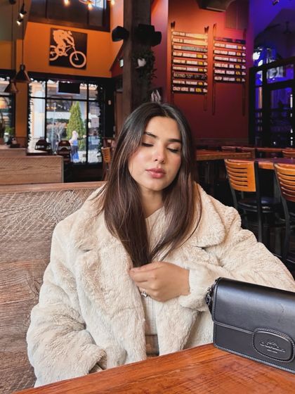 A candid shot inside a restaurant at Blue Mountain, capturing a relaxed, cozy moment.