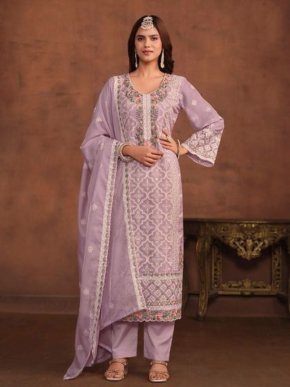 I love this soft lavender salwar kameez. The combination of white and pink thread embroidery on the organza fabric is just so pretty and perfect for a spring event.
