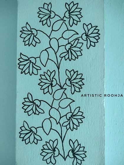 The initial black outline of the floral pillar mural before the colors were filled in.