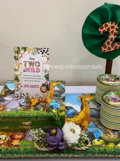 Go wild for your little one's birthday with our jungle theme hampers! This 'Born TWO be Wild' hamper for Ananya's second birthday is packed with healthy snacks like ragi chips and almond cookies, plus homemade chocolates.