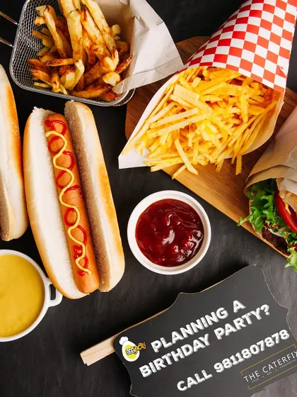 You can't go wrong with the classics. I serve delicious hot dogs with mustard and ketchup, alongside crispy golden french fries. It's the ultimate comfort food combination for any gathering.