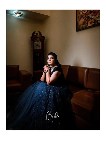 A classic and elegant portrait of the bride in her reception gown, her thoughtful expression captured beautifully.
