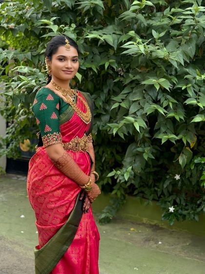 A smiling portrait of Ragavi, looking happy and confident on her wedding day. The subtle makeup approach ensures she looks like the best version of herself.
