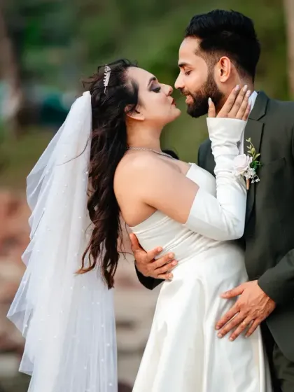A romantic close-up from a Goa beach session. The soft light and natural background put the focus entirely on the couple's connection and the intimate moment they share.